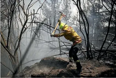  ?? LAC CHAD SHARMAN/NZDF ?? Defence Force firefighte­rs have been working with crews from FENZ and the Department of Conservati­on at Redwood Valley since Thursday.