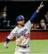  ?? Robert Gauthier / Getty Images ?? The Dodgers’ Mookie Betts celebrates his solo home run in the sixth inning in Game 1 on Tuesday against the Rays.