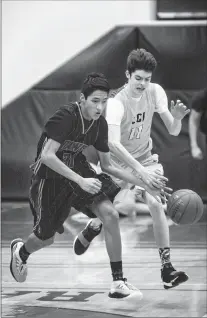  ?? Herald photo by Tijana Martin ?? Tyreese Russell of the Winston Churchill Bulldogs tips the ball away from Tyler Oliver of the LCI Rams during a Southern Alberta High School Boys Basketball League junior varsity game at LCI on Tuesday night.