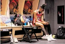  ?? KAITLIN MCKEOWN kmckeown@newsobserv­er.com ?? N.C. State’s Saniya Rivers sits in the locker room following the Wolfpack’s 78-59 Final Four loss to South Carolina at Rocket Mortgage FieldHouse on Friday, April 5, 2024, in Cleveland, Ohio.
