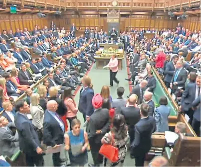  ??  ?? SNP MPS walk out of the House of Commons during Prime Minister’s Questions.