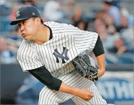  ?? JULIE JACOBSON/AP PHOTO ?? Masahiro Tanaka retired the first 17 batters and struck out a career-high 14 to lead the Yankees to a 6-1 win over the Tampa Bay Rays on Friday night in the Bronx. It was New York’s fifth straight win.