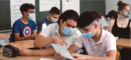  ?? (Foto AFP) ?? memberi kesan dalam aspek pendidikan dan kehidupan pelajar.