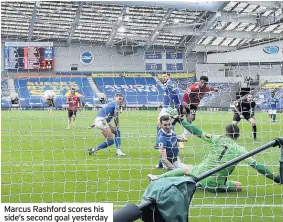  ??  ?? Marcus Rashford scores his side’s second goal yesterday