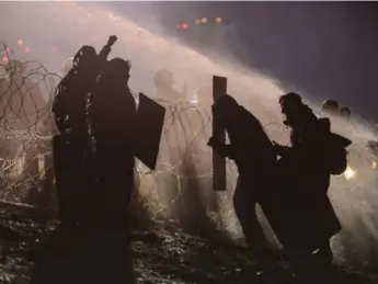  ?? STEPHANIE KEITH/REUTERS ?? Police use a water cannon during a protest against the Dakota Access pipeline near the Standing Rock reservatio­n.