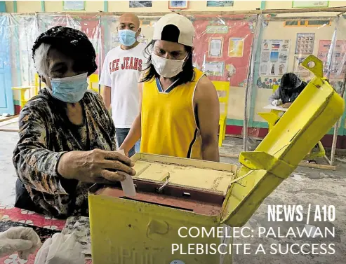  ?? —ROMAR MIRANDA ?? POLLING AMID PANDEMIC At 50 to 60 percent, the voter turnout was still considered “high” for Saturday’s electoral exercise that decides whether Palawan will be split into three provinces. Residents of Barangay Panacan Uno, for example, went out to cast their vote despite the rain and the raging pandemic.