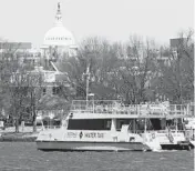  ?? JACQUELYN MARTIN/AP ?? A water taxi makes its way last week past Fort McNair, an Army post near the U.S. Capitol. The Army wants to add a buffer zone along the shoreline.