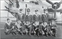 ?? PHOTO COURTESY OF THERESA SELL ?? The 20th Reconnaiss­ance Squadron in front of their F-7 aircraft. Anthony Marchione, kneeling second from the right, was the last man to die in World War II.