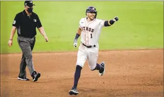  ?? Gregory Bull Associated Press ?? HOUSTON SHORTSTOP Carlos Correa takes a joyous trot around the bases after his home run.