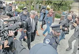  ?? Kirk McKoy Los Angeles Times ?? WILLIAM B. TAYLOR JR., center left, pictured arriving for his explosive Oct. 22 closed-door hearing, will be first to testify in the public impeachmen­t hearings.