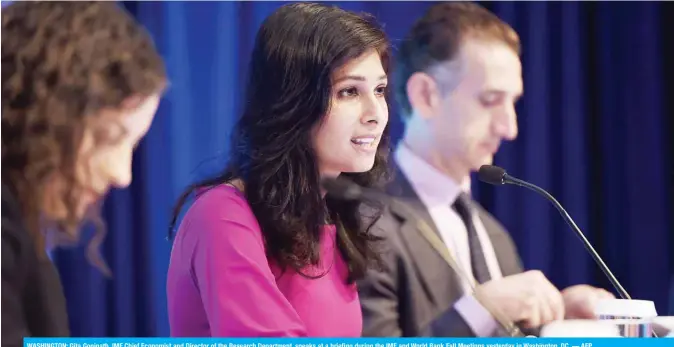  ?? — AFP ?? WASHINGTON: Gita Gopinath, IMF Chief Economist and Director of the Research Department, speaks at a briefing during the IMF and World Bank Fall Meetings yesterday in Washington, DC.