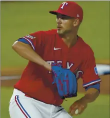  ?? TONY GUTIERREZ — THE ASSOCIATED PRESS ?? Texas Rangers starting pitcher Mike Minor was traded to the Athletics for a pair of minor leaguers and internatio­nal slot money on Monday.