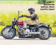  ??  ?? LUSTY Bonneville waltzes down country lanes