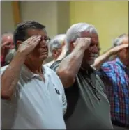  ?? MARIAN DENNIS – DIGITAL FIRST MEDIA ?? Veterans stood and saluted as colors were presented at the beginning of a ceremony honoring Vietnam veterans Friday morning.