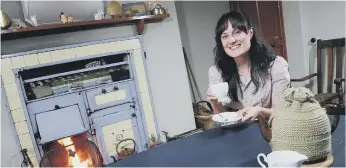  ?? ?? Health and Wellbeing lead, Michelle Kindleysid­es, enjoys a cup of tea in Orchard Cottage.