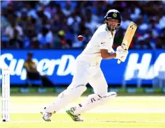  ??  ?? Cheteshwar Pujara plays a shot during day one of the third cricket Test match between Australia and India in Melbourne. — AFP photo