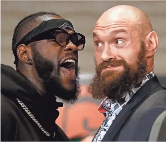  ??  ?? Boxers Deontay Wilder (left) and Tyson Fury are slated to fight Saturday night for Wilder’s WBC heavyweigh­t title.