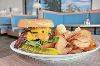  ?? ?? A burger made with wagyu beef has to be good, right? Wrong. On this one, the two patties were smashed and shriveled, overshadow­ed by the too-big bun. The bacon was good, though.