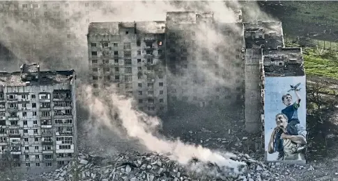  ?? ?? SMOKING RUINS: Moscow says it has taken the shattered city of Bakhmut, but Ukraine insists fighting goes on there.