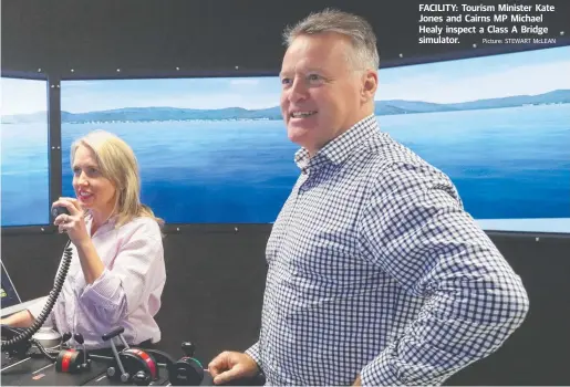  ?? Picture: STEWART McLEAN ?? FACILITY: Tourism Minister Kate Jones and Cairns MP Michael Healy inspect a Class A Bridge simulator.