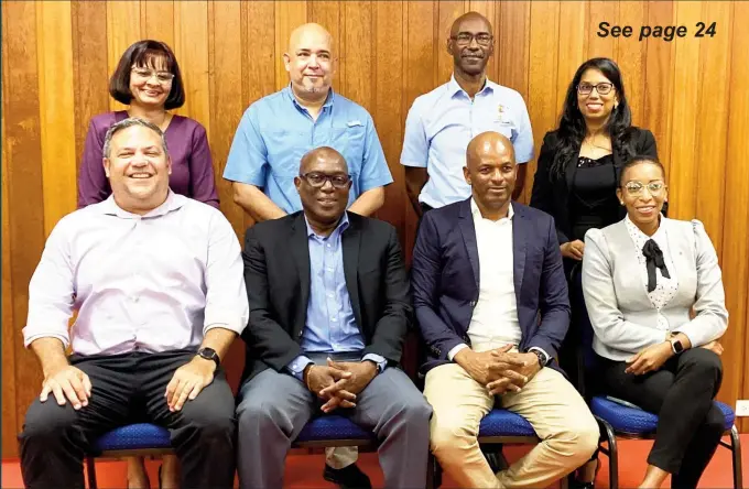  ?? ?? The Guyana Olympic Associatio­n is now headed by Godfrey Munroe, (seated second from right). He is flanked by executive members, Vice Presidents, from left, Philip Fernandes, Steve Ninvalle and Cristy Campbell. Standing (from left) are Emelia Ramdhani, Mike Singh, Garfield Wiltshire and Vidushi Persaud-McKinnon. (Emmerson Campbell photo)