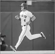  ?? Oklahoma State's Andrew Navigato drove in the tying run before scoring the winning run in the Cowboys' series-opening victory against Iowa on Friday. TERRY/THE OKLAHOMAN] [BRYAN ??