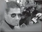  ?? AP-H. Rumph Jr., File ?? In this 1997 file photo, Joseph “Skinny Joey” Merlino talks to the media outside the Criminal Justice Center in Philadelph­ia. On Friday, The Associated Press reported on stories circulatin­g online incorrectl­y claiming the campaign for President-elect Joe Biden paid Merlino, who was once a mob boss in Philadelph­ia, to fill out 300,000 blank ballots.