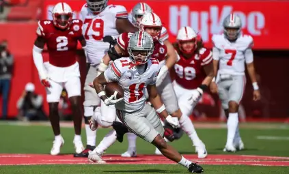  ?? Steven Branscombe, Getty Images ?? Ohio State wide receiver Jaxon Smith-njigba runs for yards after the catch against the Nebraska Cornhusker­s in the second half at Memorial Stadium on Saturday.