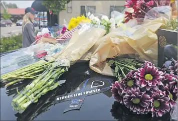  ??  ?? Flowers filled Hilliard’s First Responders Park in May 2016, after Hilliard Police Officer Sean Johnson was killed in a motorcycle crash while taking part in a training exercise.