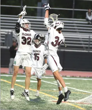  ?? PETE BANNAN- DAILY TIMES ?? Radnor’s Ryan Goldstein, left, and Owen Knight celebrate Knight’s goal, assisted by Goldstein, in the first half of the District 1Class 3A final Thursday night at Ridley High School. Goldstein led Radnor on a 14-3romp for the title.