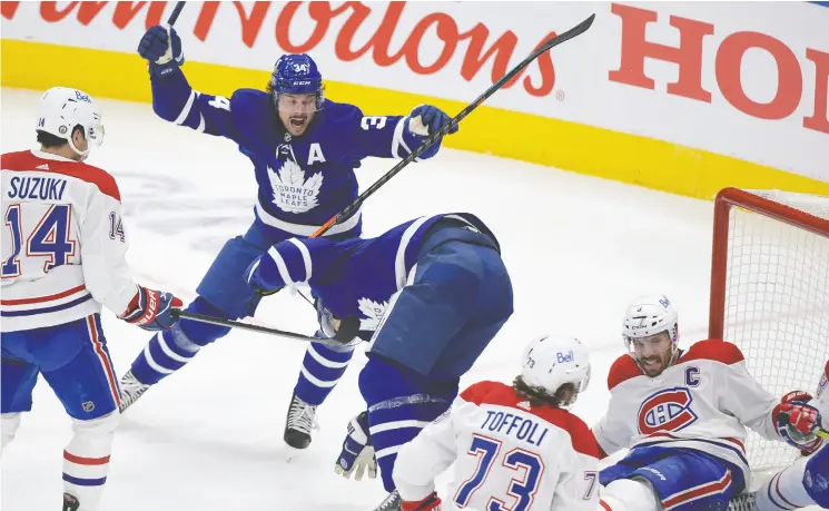  ?? DAN HAMILTON / USA TODAY SPORTS ?? Toronto’s Auston Matthews celebrates linemate Zach Hyman’s goal against the Canadiens in Game 5. Matthews has scored just once in the series.