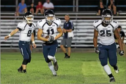  ?? DENNIS KRUMANOCKE­R - FOR DIGITAL FIRST MEDIA ?? Kutztown’s Tyler Fisher (11) goes on an end around as Caleb Riegel leads the way.