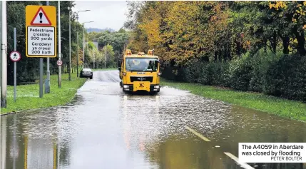  ?? PETER BOLTER ?? The A4059 in Aberdare was closed by flooding