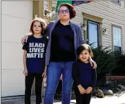  ?? FRED SQUILLANTE / COLUMBUS DISPATCH ?? Pint Size Protesters gave Dublin mom Lily Cunningham a way to educate her daughters Zoe, 8, and Olive, 4, about unrest and racial justice unfolding around them.