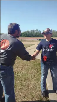  ?? SUBMITTED PHOTO ?? Bill Olson, left, congratula­tes Austin Davis for being named the high overall winner in the junior division at the O2 Shootout in April 2018. The shooting-sports tournament was named after Will Olson and Camdon Osborn, who died in a car accident in 2015. Austin was an avid shooter and was on the Batesville High School trap-shooting team. He died in May, and a scholarshi­p has been establishe­d in his memory.