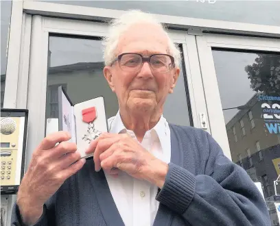  ??  ?? Dennis Jones, 91, received an MBE for services to Citizens’ Advice. He is pictured outside the office in Bridgend