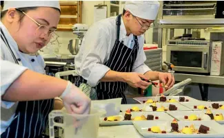  ?? PHOTO: DOUG FIELD/STUFF ?? Ara student chefs Denice Marayag and Edsant Obillo, both 22, carrying out their seventh trial run of their three course meal ahead of competitio­n.