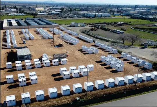  ?? MATT BATES — ENTERPRISE-RECORD ?? A drone shot of the new micro shelters off of Martin Luther King Drive, looking east toward paradise. The micro shelters hope to house up to 177homeles­s people as part of an agreement the city of Chico made.