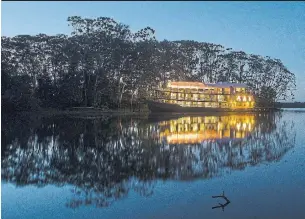  ?? G ADVENTURES ?? A riverboat glows warmly on the Amazon after dark. A woolly monkey resident of the Peruvian Amazon, one of several possible wildlife sightings on the river.