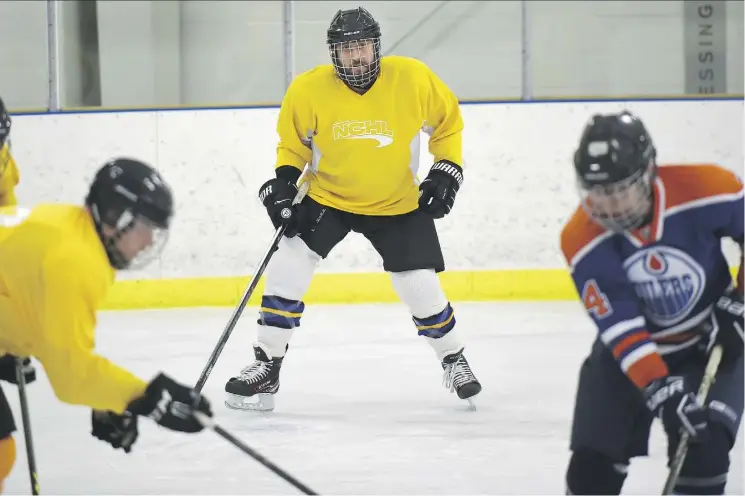  ?? ED KAISER ?? Reporter Juris Graney, centre, plays in the final game of his Discover Hockey program at the Clareview Recreation Centre last week.