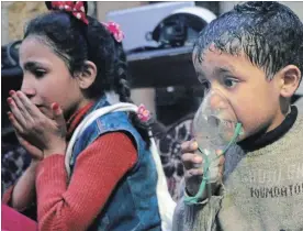  ??  ?? This image released early Sunday by the Syrian Civil Defence White Helmets shows a child receiving oxygen after an alleged poison gas attack in the rebel-held town of Douma, near Damascus, Syria. Rescuers and medics said the attack on Douma killed at...