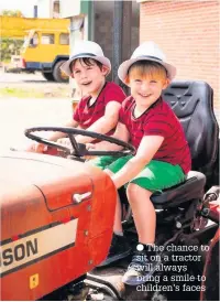  ?? The chance to sit on a tractor will always bring a smile to children’s faces ??