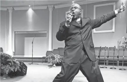  ?? COMMERCIAL APPEAL ?? Bishop Brandon B. Porter delivers a sermon at the Greater Community Temple Church of God in Christ location on Winchester on the Sunday before the start of the annual COGIC Holy Convocatio­n in November 2010. MIKE BROWN / THE