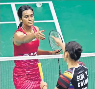  ?? AFP ?? India's PV Sindhu shakes hands with China's Sun Yu after her win in their women's singles quarterfin­al at the BWF World Championsh­ips at Emirates Arena in Glasgow on Friday.