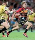  ??  ?? Damian McKenzie bursts down field for the Chiefs in their draw with the Hurricanes.