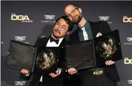  ?? CHRIS PIZZELLO — THE ASSOCIATED PRESS ?? Daniel Kwan, left, and Daniel Scheinert pose in the press room with the award for outstandin­g directoria­l achievemen­t in a theatrical feature film for “Everything Everywhere All at Once” at the 75th annual Directors Guild of America Awards, Feb. 18, 2023, at the Beverly Hilton hotel in Beverly Hills.