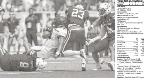  ?? Tim Warner photos ?? Red Raiders running back Desmond Nisby (32) gets into the end zone as UH safety Terrell Williams (23) tries to stop him in the second quarter Saturday at TDECU Stadium.