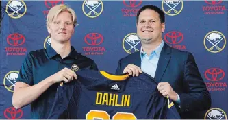  ?? JEFFREY T. BARNES THE ASSOCIATED PRESS ?? Rasmus Dahlin, left, is expected to get plenty of ice time in Buffalo during the rebuild.