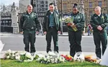  ?? Reuters ?? ■ Emergency services workers pay their respects at Parliament Square in Westminste­r on the anniversar­y of the Westminste­r Bridge attack in London yesterday.