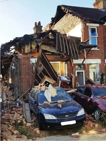  ??  ?? Reduced to rubble: The explosion destroyed the top floor of the house, where suspect Ian Clowes lived